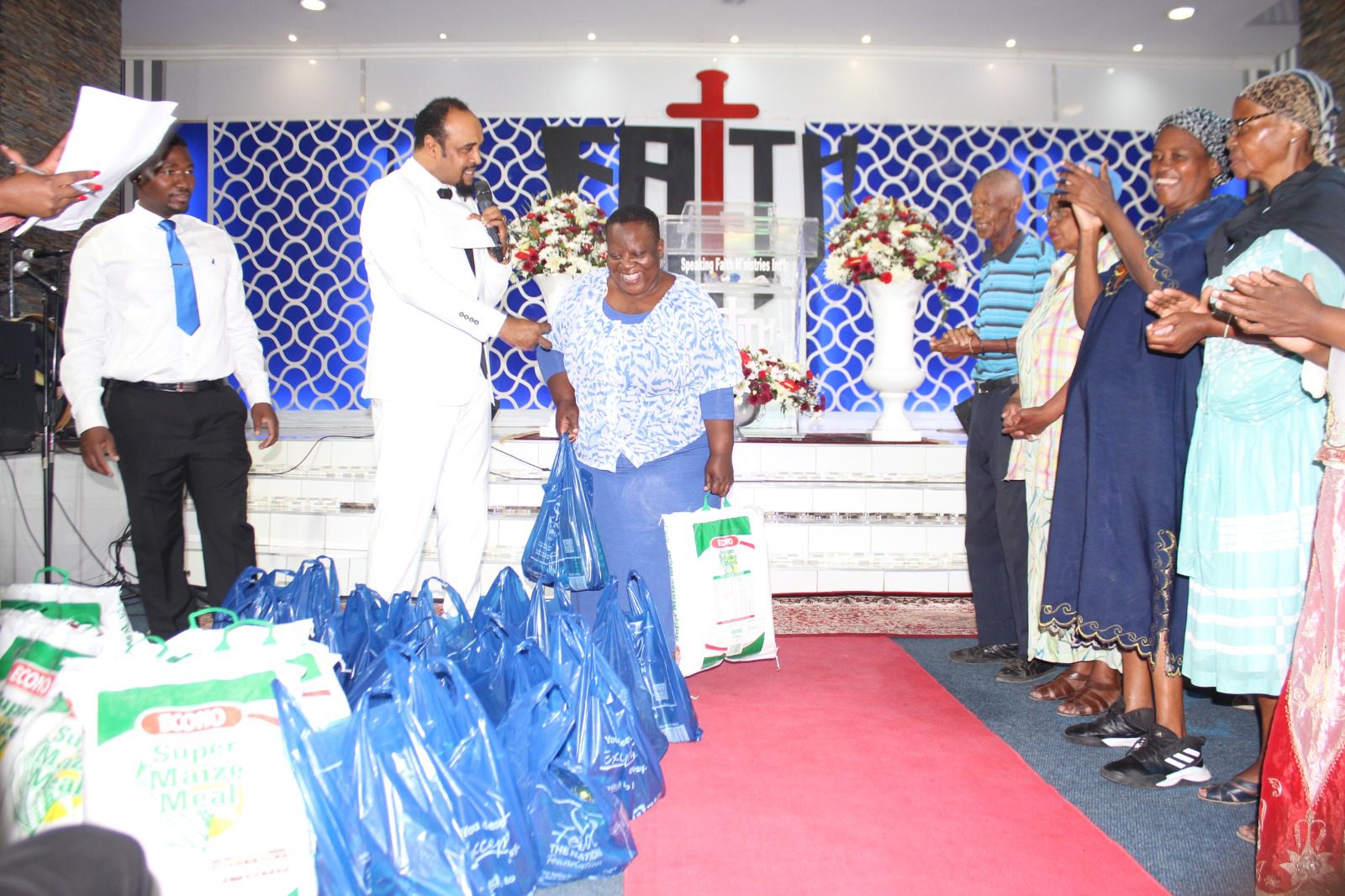 Pastor Howard donates food parcels to the needy in Alex